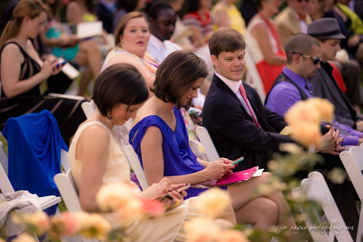 wedding guests checking iPhones