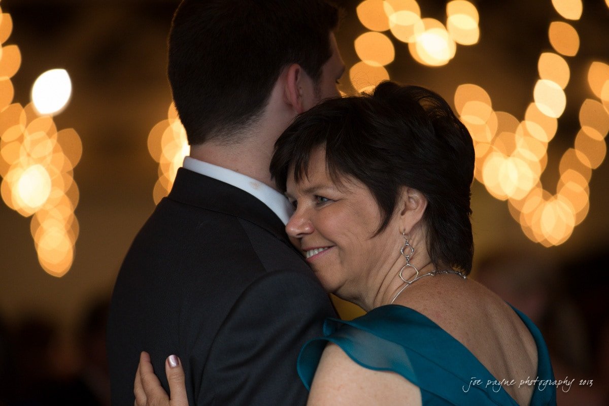 mom and son dance at stockroom wedding