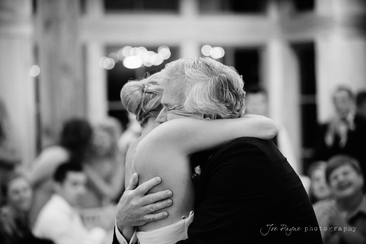 bride and dad embrace after dance