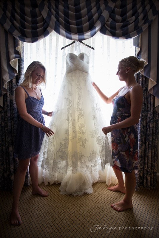 bride and sister look at pronovias dress